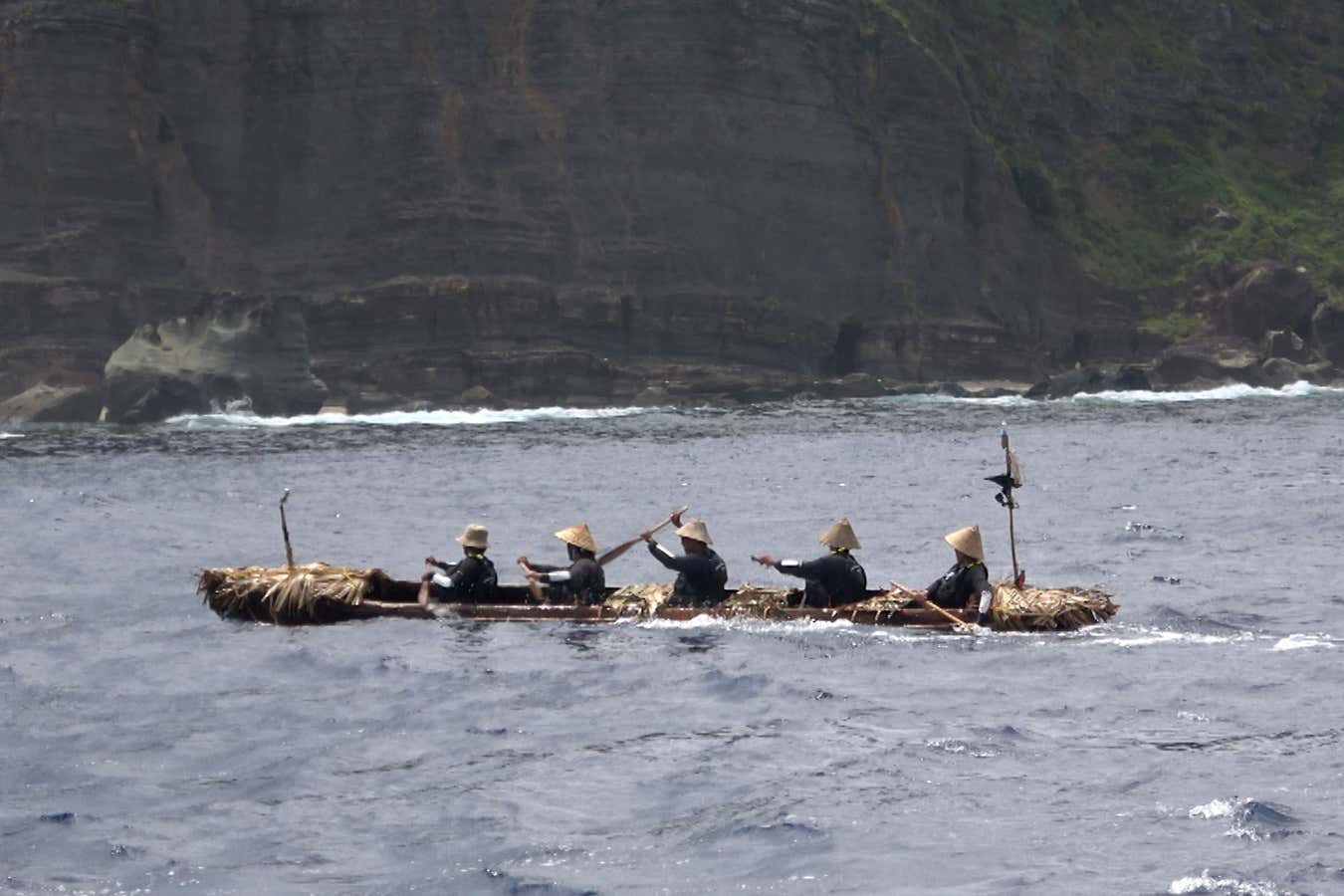 Researchers in dugout canoe
